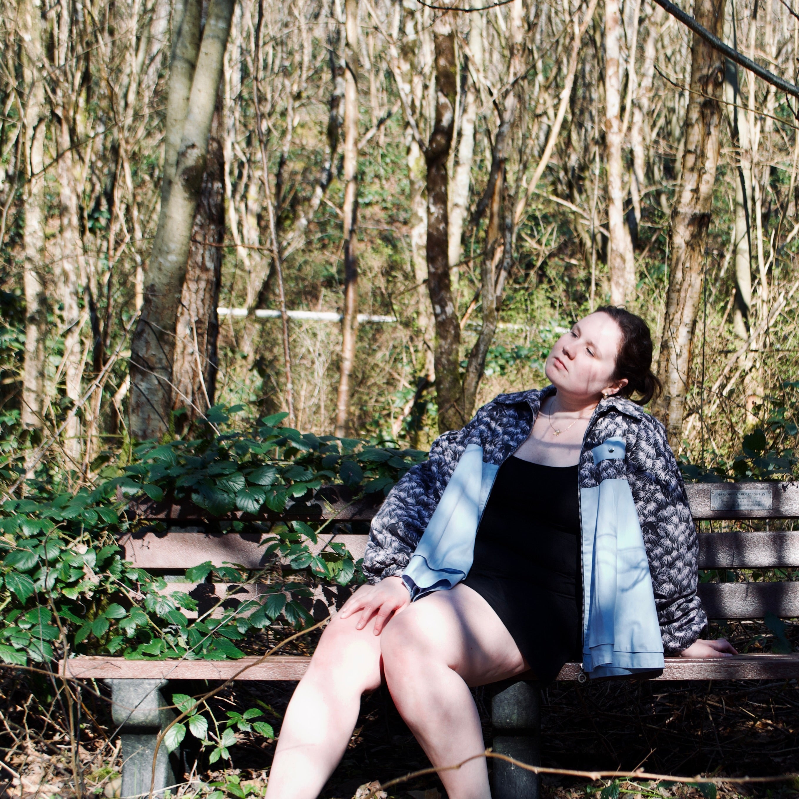 lightweight sustainable bomber jacket for women with black floral and animal print with blue contrast
