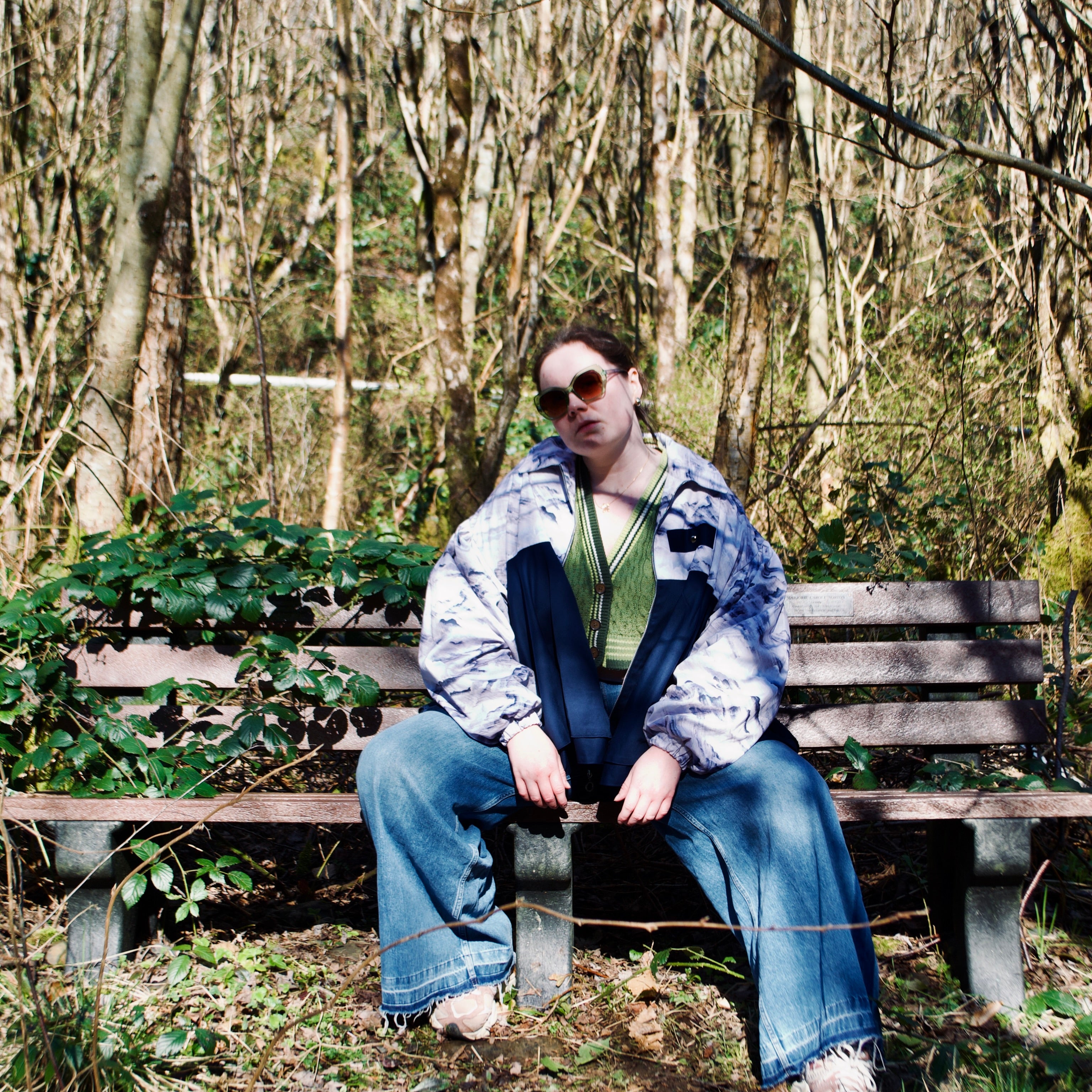 lightweight sustainable bomber jacket for women with blue and cream cloud print and navy contrast