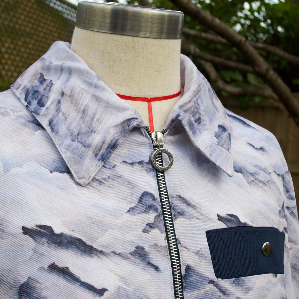 handmade sustainable lightweight jacket for women 100% cotton patterned fabric, blue and cream bomber jacket with collar and breast pocket, popper fastenings and zip closure 