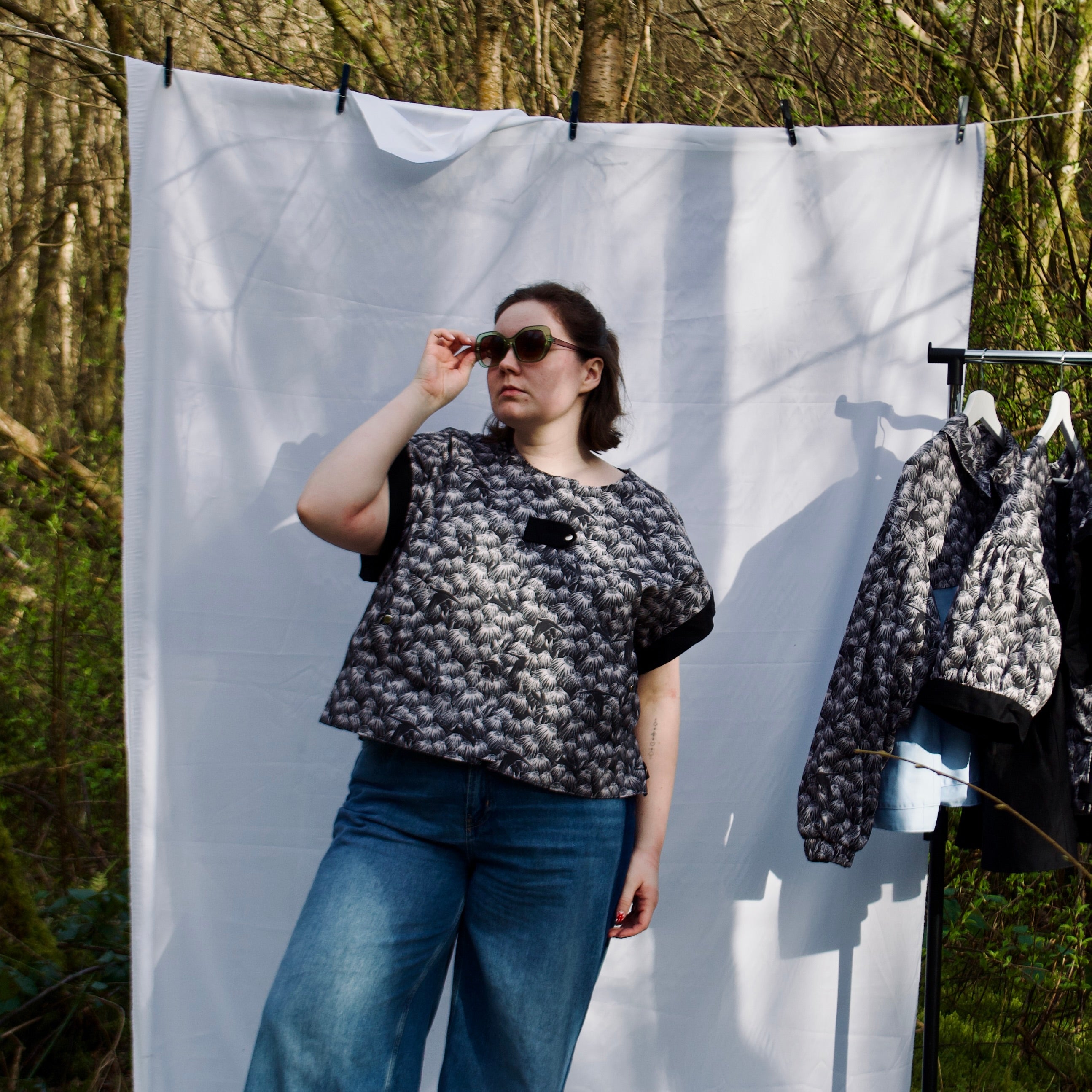 exclusive chic floral print on 100% cotton fabric, black and white whimsical gilet vest with black contrast trim, handmade, lightweight for spring summer, oversized casual fit, hidden zip closure, concealed pockets with popper fastening, side openings for inclusive sizing and added movement