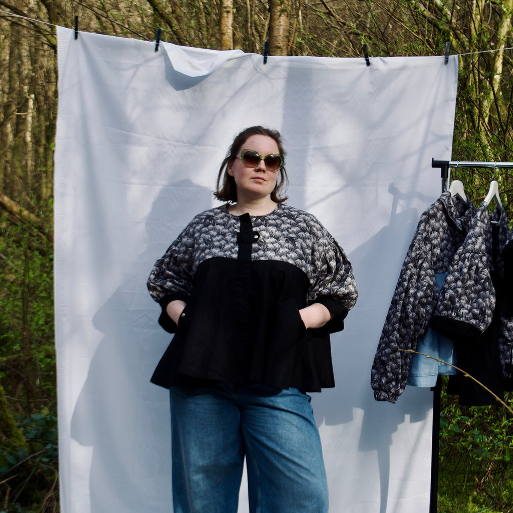 casual spring summer jacket with cute black floral and animal print, short puff sleeves, handmade with 100% cotton fabric, hidden zip closure and pockets with snap fastening, oversized fit, unique gathered ruffle silhouette. sustainable lightweight jacket for women 
