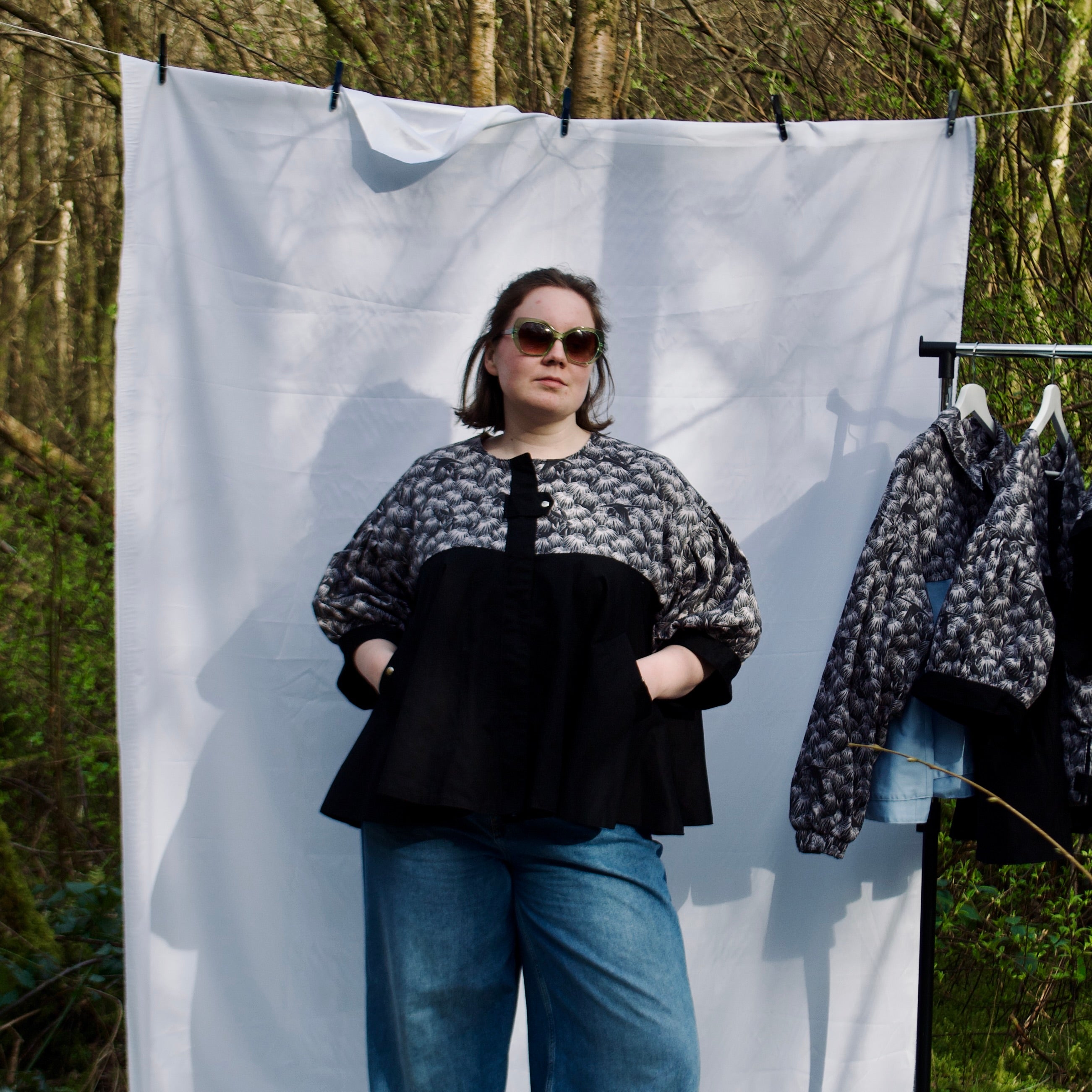 casual spring summer jacket with cute black floral and animal print, short puff sleeves, handmade with 100% cotton fabric, hidden zip closure and pockets with snap fastening, oversized fit, unique gathered ruffle silhouette. sustainable lightweight jacket for women 