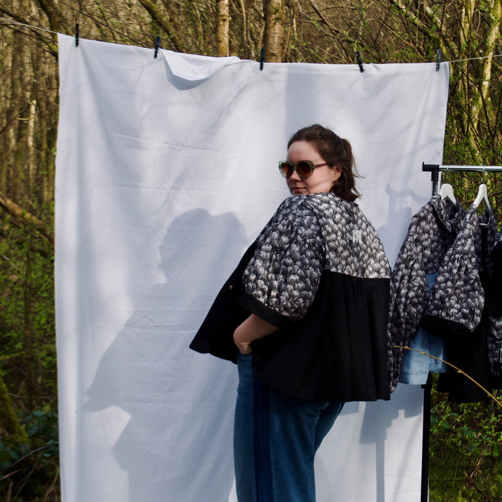 casual spring summer jacket with cute black floral and animal print, short puff sleeves, handmade with 100% cotton fabric, hidden zip closure and pockets with snap fastening, oversized fit, unique gathered ruffle silhouette. sustainable lightweight jacket for women 