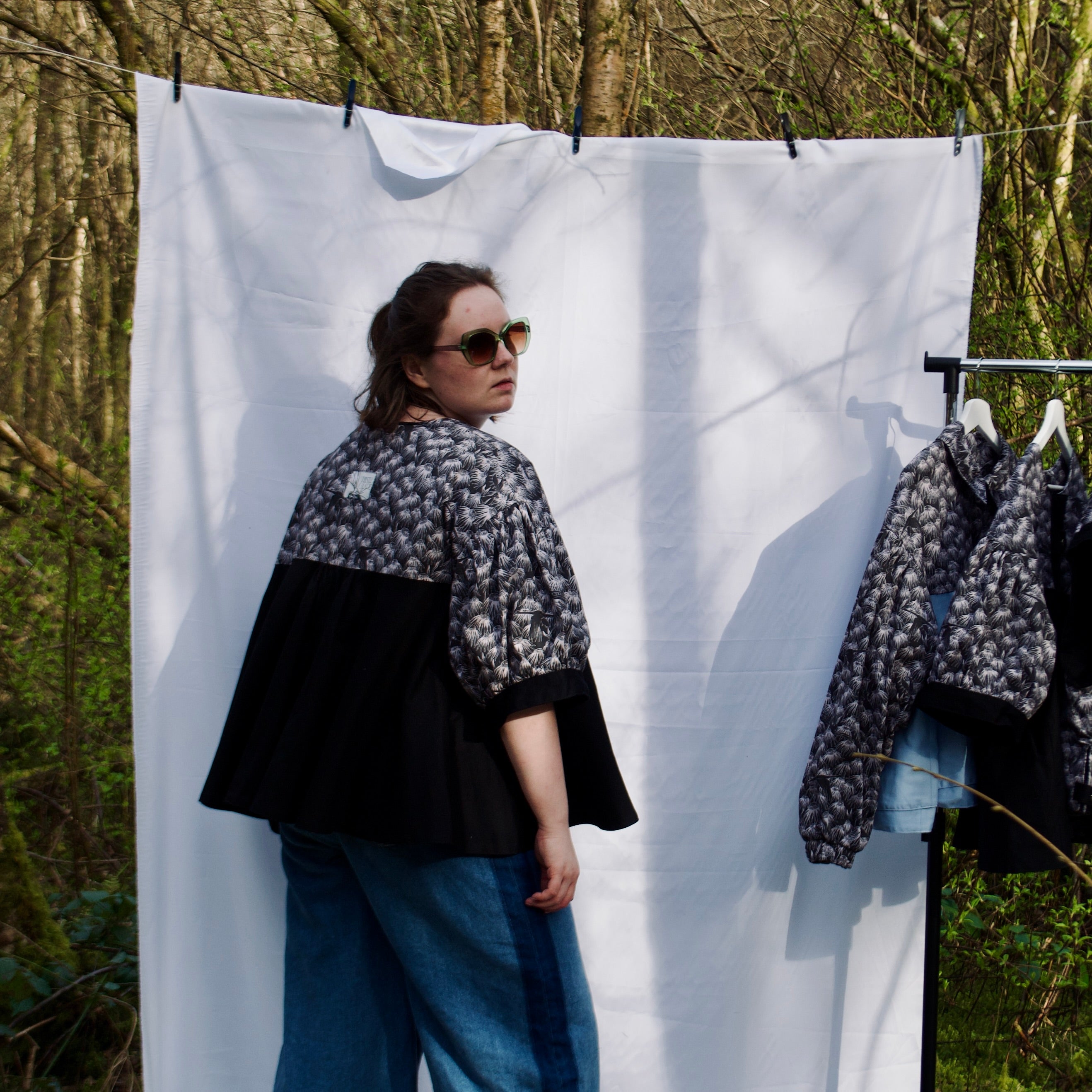casual spring summer jacket with cute black floral and animal print, short puff sleeves, handmade with 100% cotton fabric, hidden zip closure and pockets with snap fastening, oversized fit, unique gathered ruffle silhouette. sustainable lightweight jacket for women 