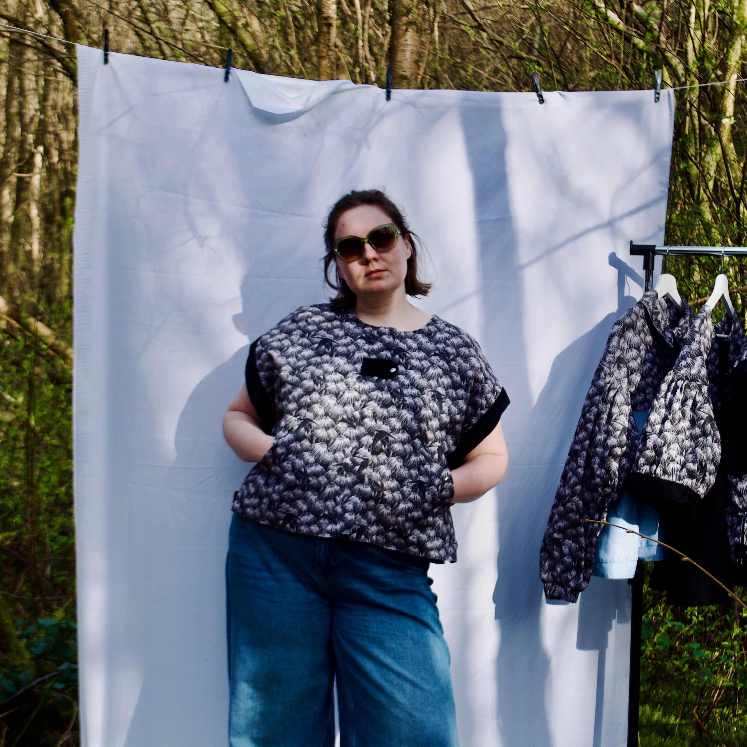 exclusive chic floral print on 100% cotton fabric, black and white whimsical gilet vest with black contrast trim, handmade, lightweight for spring summer, oversized casual fit, hidden zip closure, concealed pockets with popper fastening, side openings for inclusive sizing and added movement