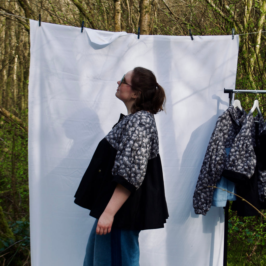 casual spring summer jacket with cute black floral and animal print, short puff sleeves, handmade with 100% cotton fabric, hidden zip closure and pockets with snap fastening, oversized fit, unique gathered ruffle silhouette. sustainable lightweight jacket for women 
