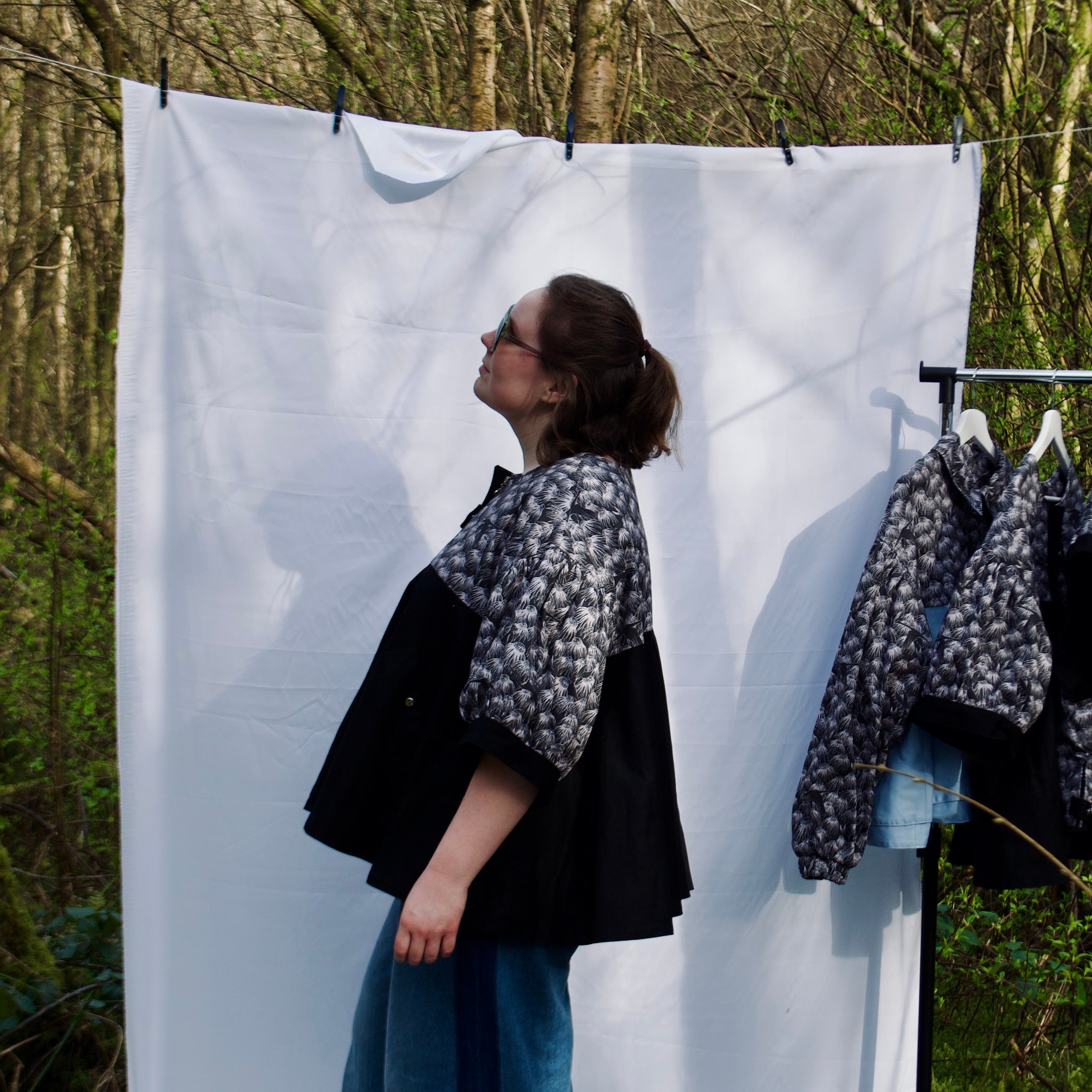 casual spring summer jacket with cute black floral and animal print, short puff sleeves, handmade with 100% cotton fabric, hidden zip closure and pockets with snap fastening, oversized fit, unique gathered ruffle silhouette. sustainable lightweight jacket for women 
