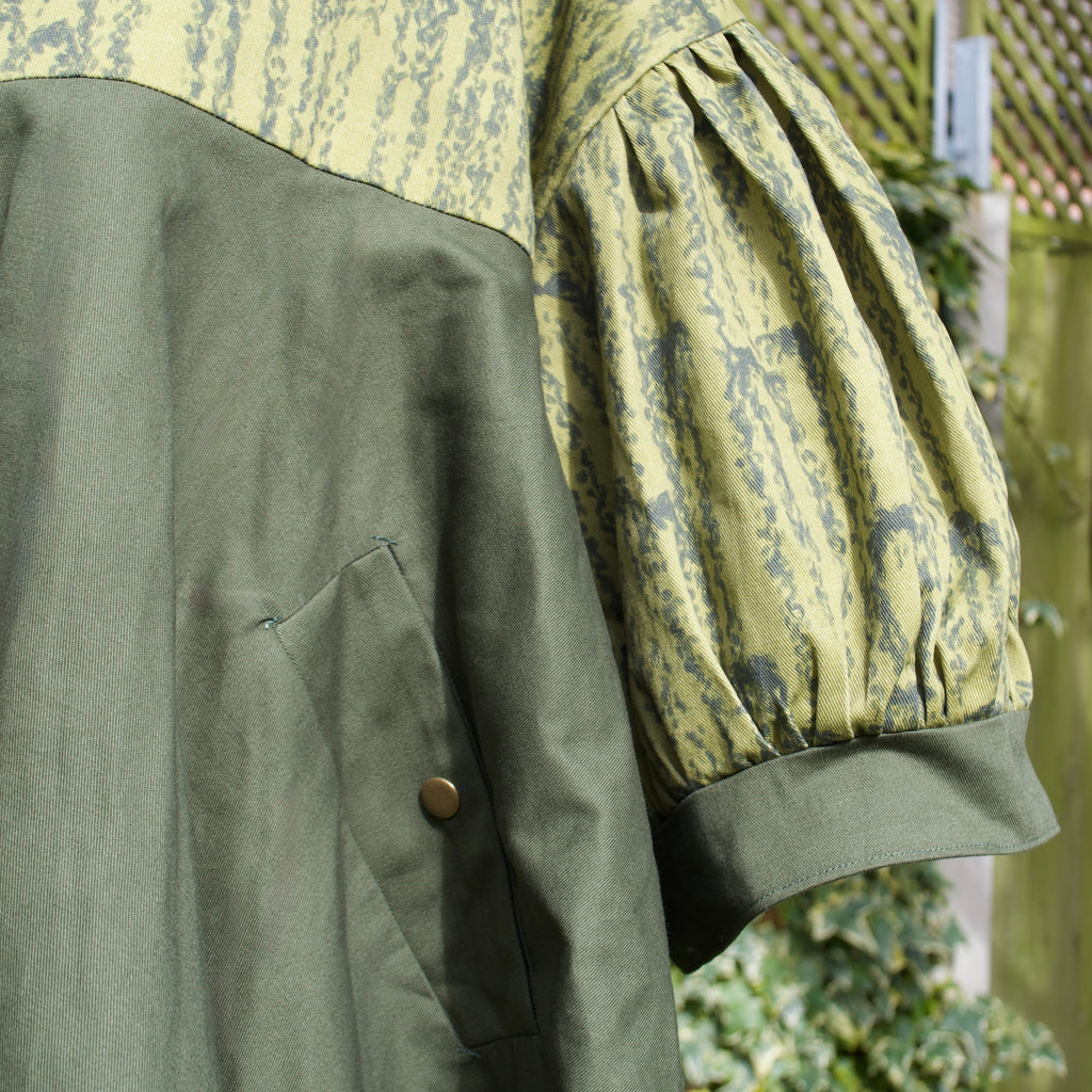 exclusive luxurious willow print on 100% sustainable fabric, puff sleeves, oversized fit, olive and dark green print with concealed pockets and popper fastening