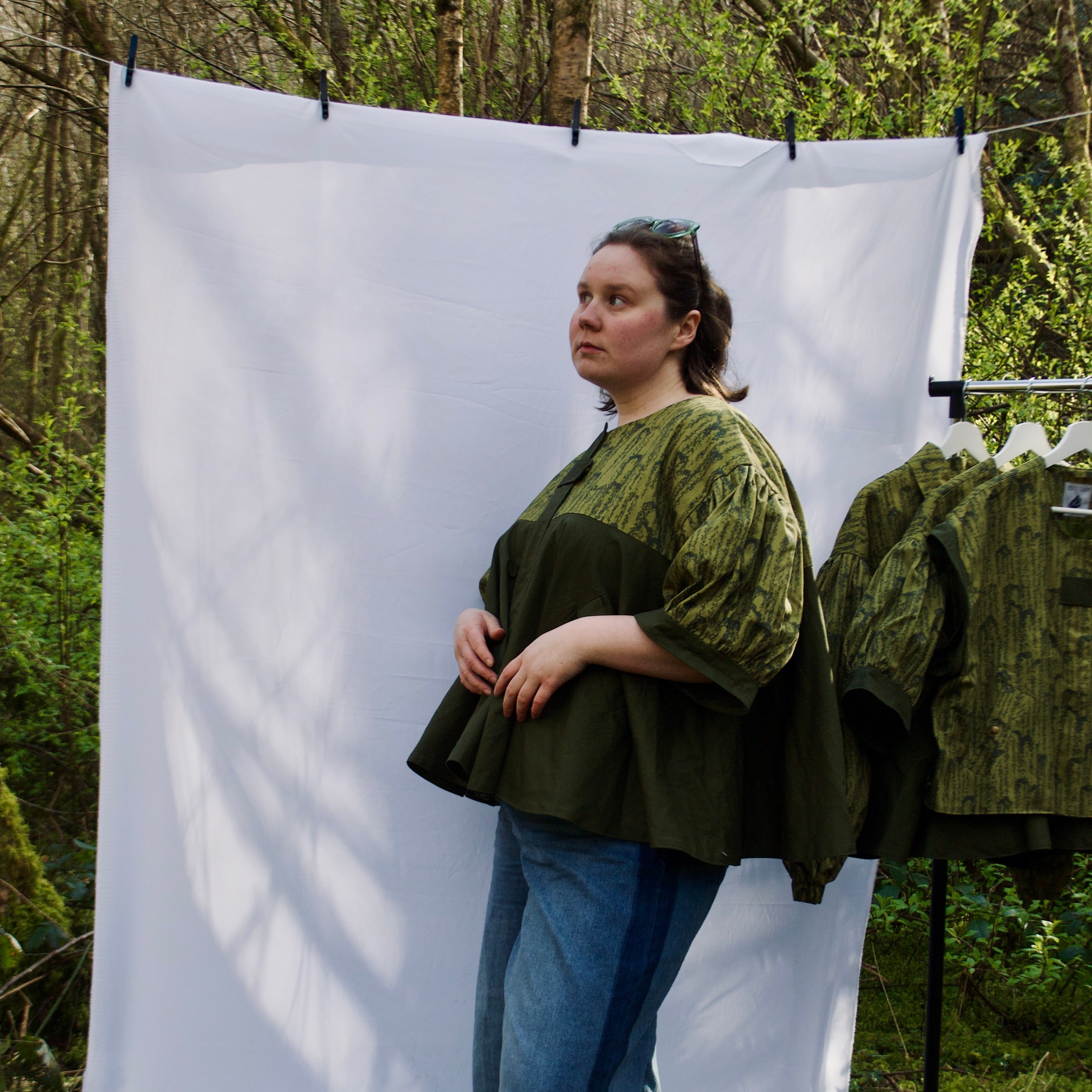 unique short sleeve jacket for women with luxury greens, sustainable lightweight 100% cotton fabric, perfect for spring summer, handmade with hidden zip closure and pockets with snap fastening, oversized fit, unique gathered ruffle silhouette. 