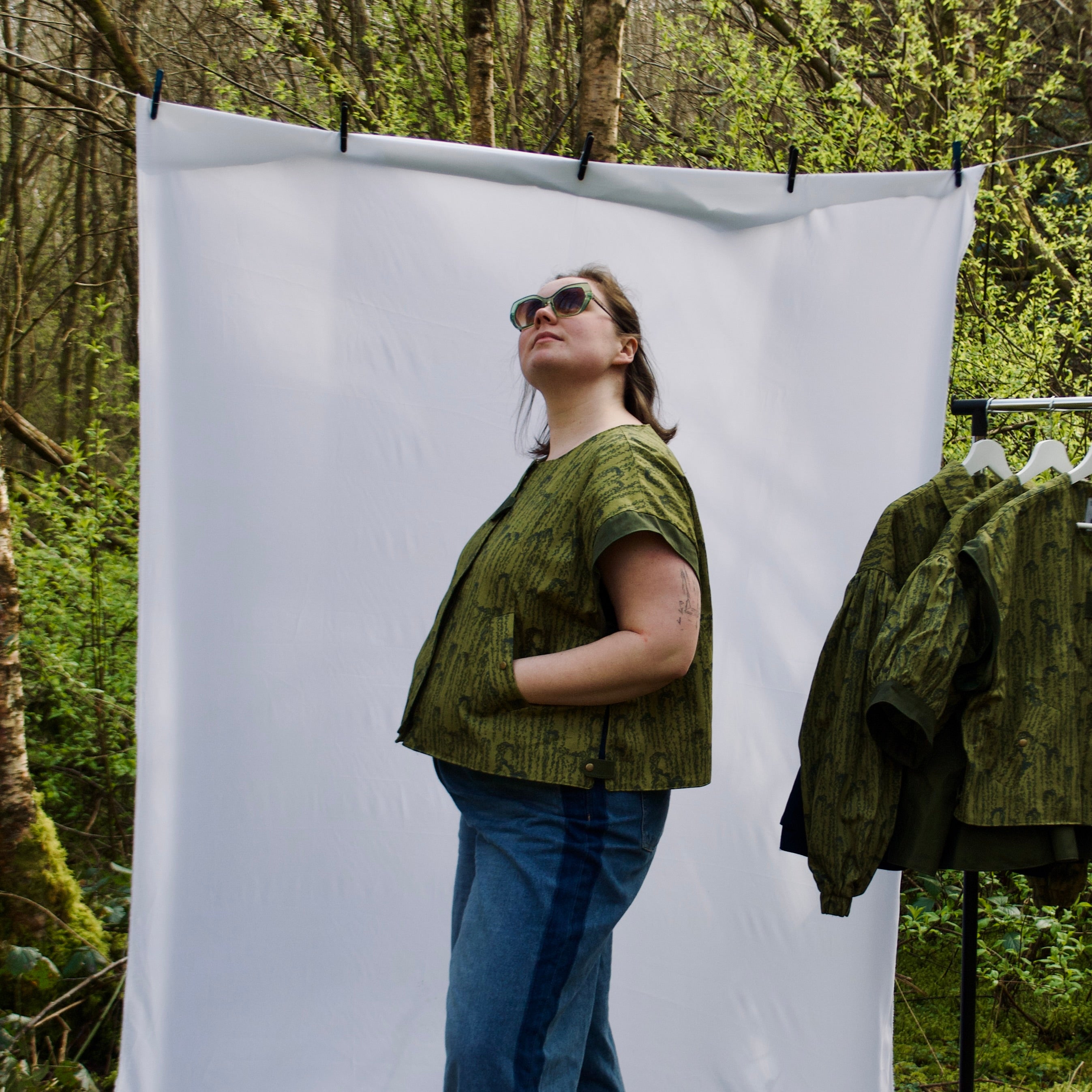 exclusive chic leaf print on 100% cotton fabric, olive and dark green luxury gilet with dark contrast trim, handmade, lightweight for spring summer, oversized casual fit, hidden zip closure, concealed pockets with popper fastening, side openings for inclusive sizing and added movement