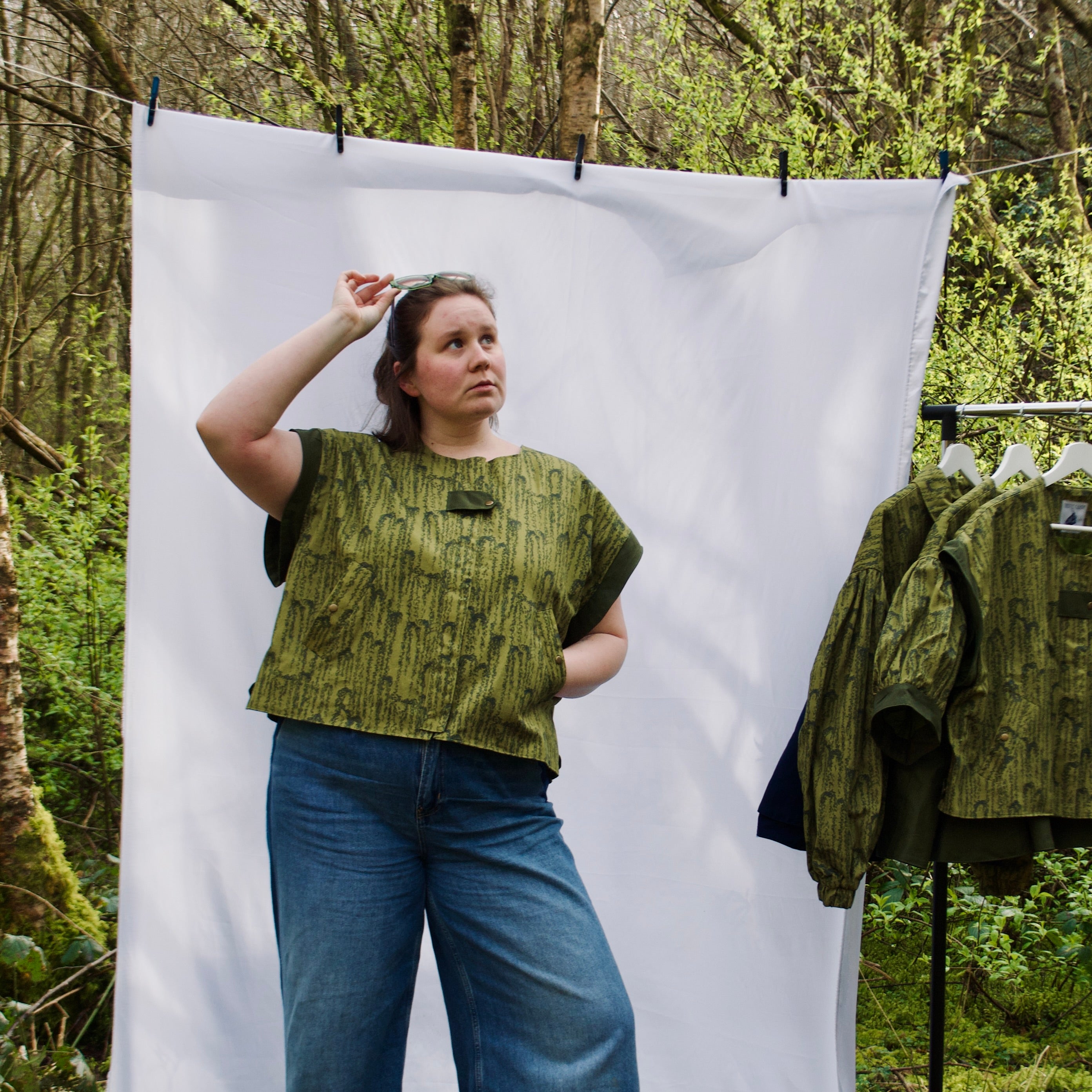 exclusive chic leaf print on 100% cotton fabric, olive and dark green luxury gilet with dark contrast trim, handmade, lightweight for spring summer, oversized casual fit, hidden zip closure, concealed pockets with popper fastening, side openings for inclusive sizing and added movement