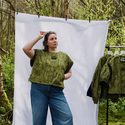 exclusive chic leaf print on 100% cotton fabric, olive and dark green luxury gilet with dark contrast trim, handmade, lightweight for spring summer, oversized casual fit, hidden zip closure, concealed pockets with popper fastening, side openings for inclusive sizing and added movement