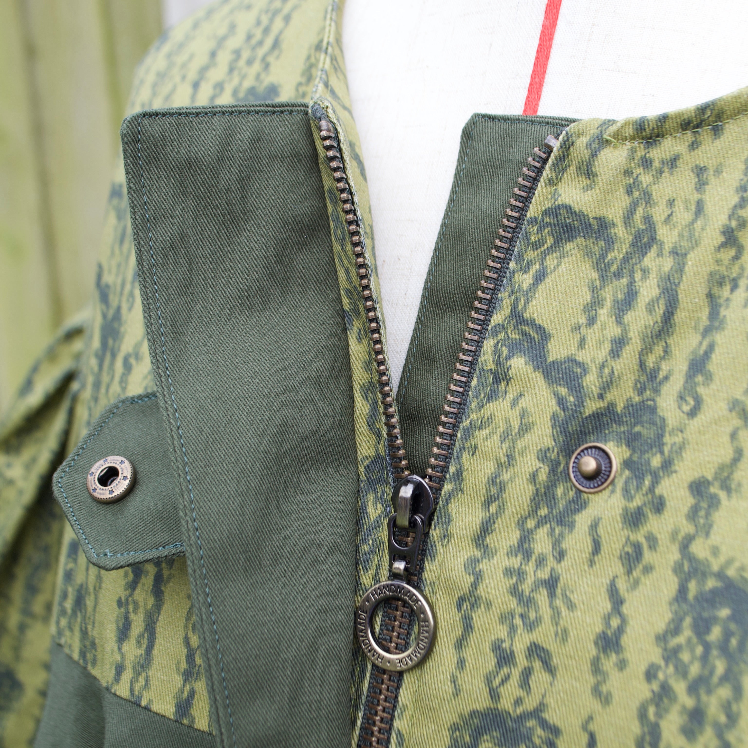 exclusive handmade chic willow leaves print on 100% cotton fabric, olive and dark green print with contrast ruffle, hidden zip closure and snap fastening
