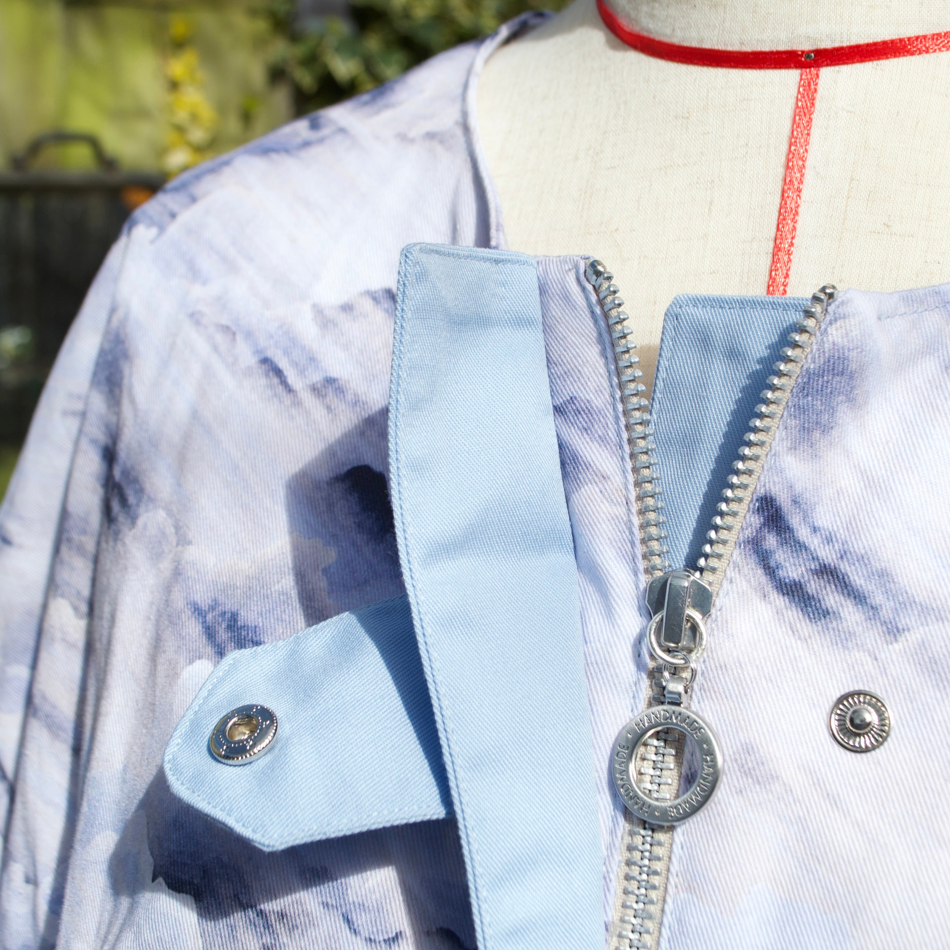 handmade sustainable spring summer jacket for women, silver zip closure and popper fastening blue marbled cloud print
