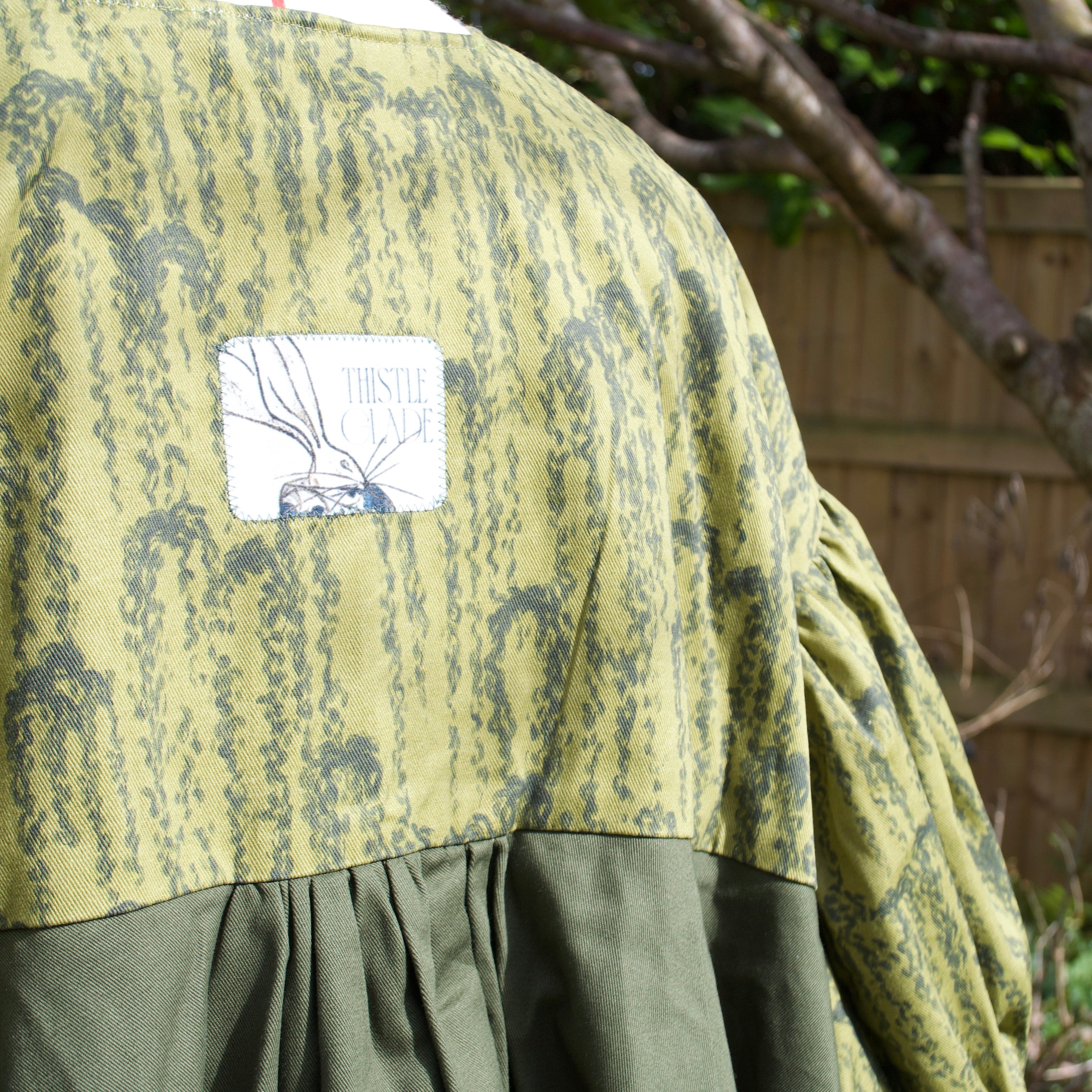exclusive luxurious willow print on 100% sustainable fabric, puff sleeves, oversized fit, olive and dark green print with gathered ruffle