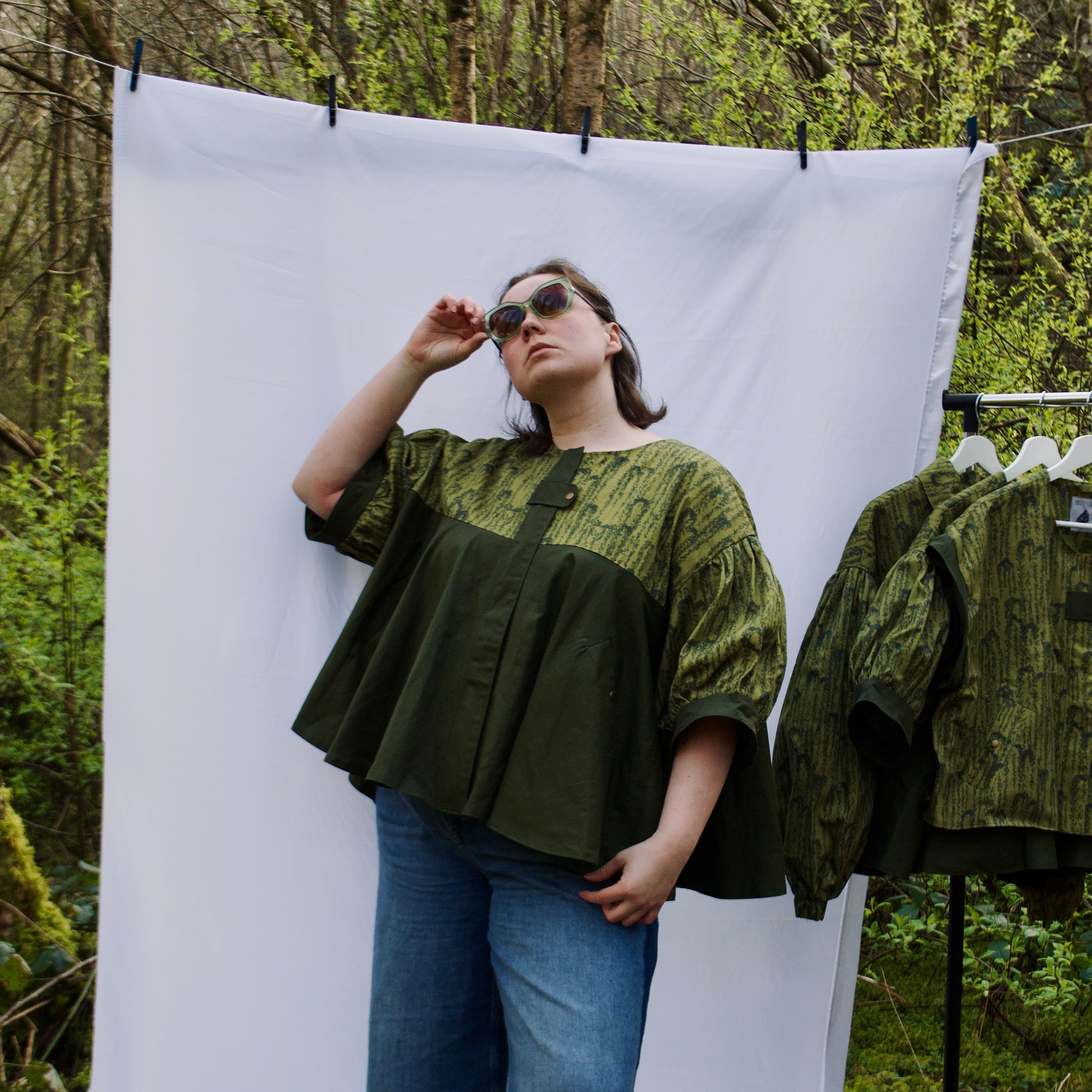unique short sleeve jacket for women with luxury greens, sustainable lightweight 100% cotton fabric, perfect for spring summer, handmade with hidden zip closure and pockets with snap fastening, oversized fit, unique gathered ruffle silhouette. 