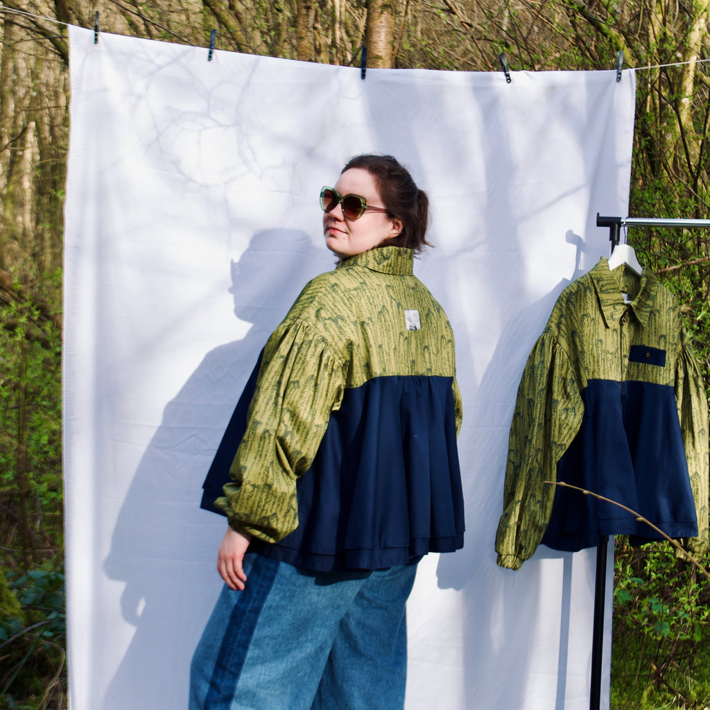 casual spring summer bomber jacket for women handmade with olive green willow leaves print with navy contrast long sleeves, elastic cuffs, collar, zip closure and contrast breast pocket, oversized fit, extra ruffle. sustainable handmade jacket for ladies
