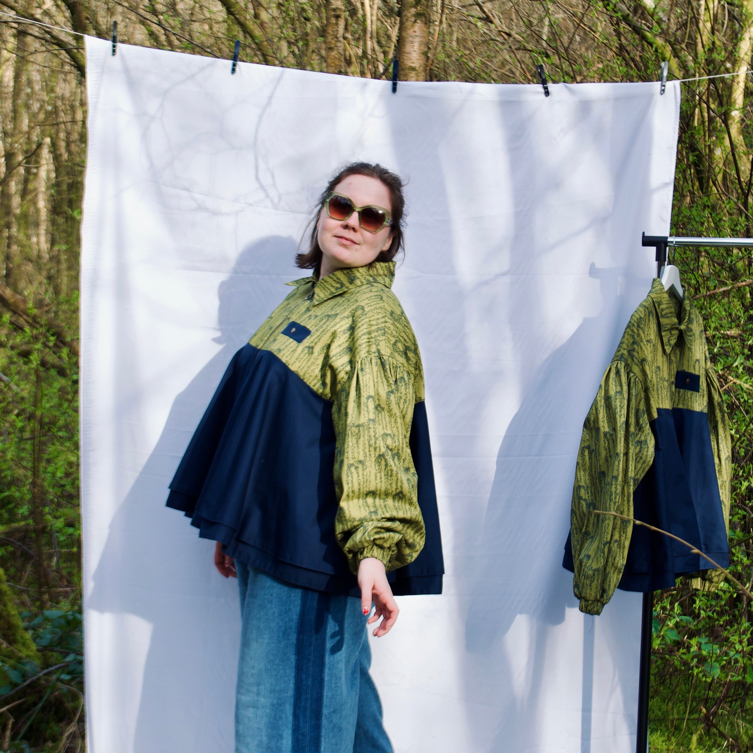 casual spring summer bomber jacket for women handmade with olive green willow leaves print with navy contrast long sleeves, elastic cuffs, collar, zip closure and contrast breast pocket, oversized fit. sustainable handmade jacket for ladies