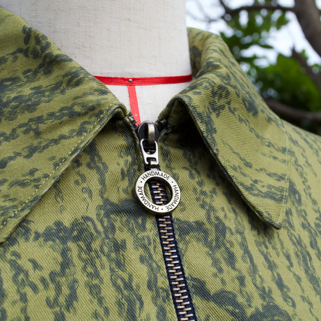 handmade sustainable lightweight jacket for women 100% cotton patterned fabric, olive green chartreuse leaves print bomber jacket with collar and breast pocket, popper fastenings and zip closure 