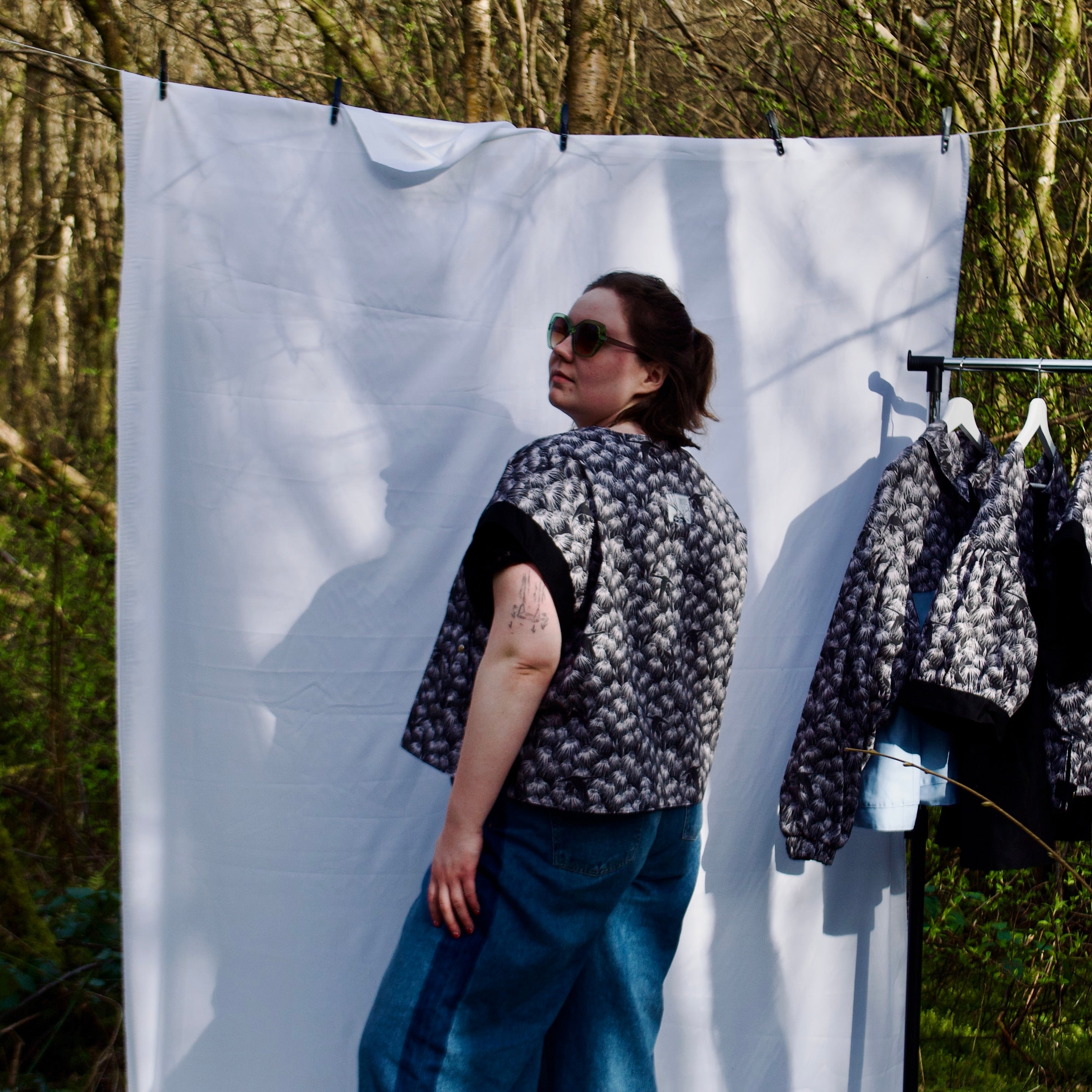 exclusive chic floral print on 100% cotton fabric, black and white whimsical gilet vest with black contrast trim, handmade, lightweight for spring summer, oversized casual fit, hidden zip closure, concealed pockets with popper fastening, side openings for inclusive sizing and added movement