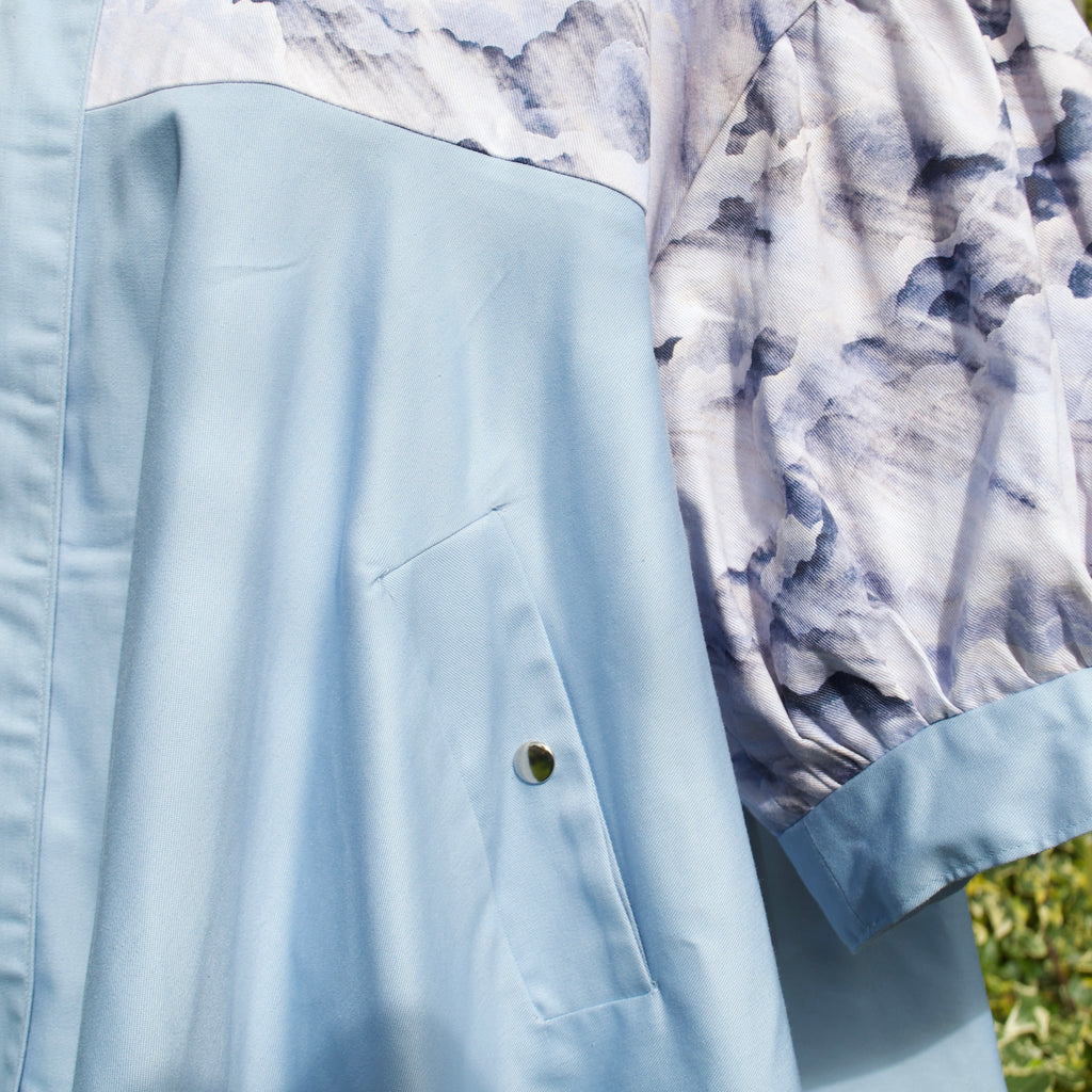 exclusive dreamy cloud print on 100% cotton fabric, puff sleeves, light blue and white print with sky blue contrast ruffle, concealed pockets with popper fastening