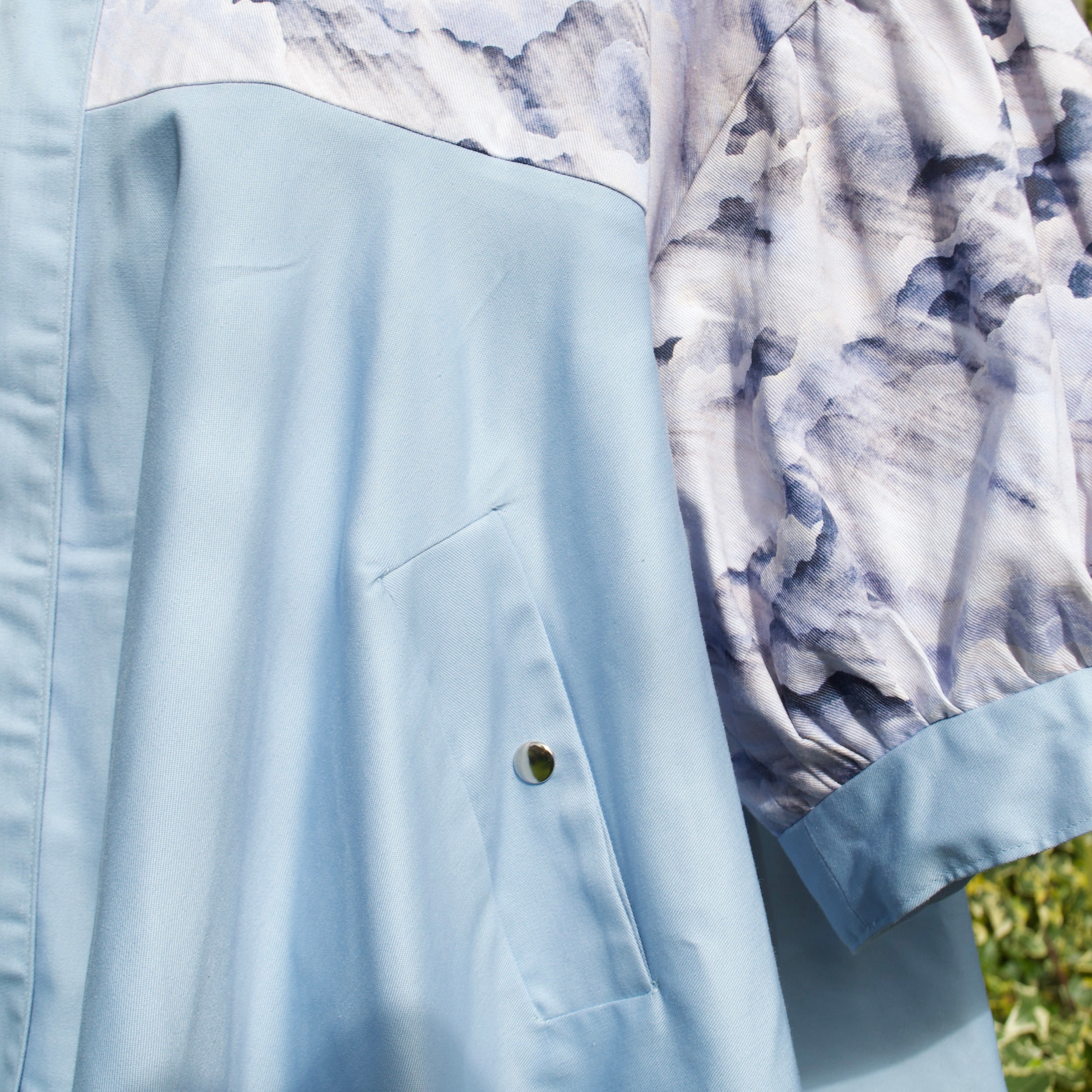 exclusive dreamy cloud print on 100% cotton fabric, puff sleeves, light blue and white print with sky blue contrast ruffle, concealed pockets with popper fastening